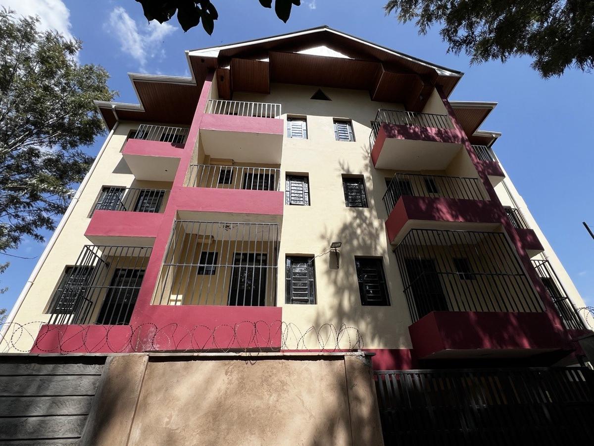 The Wave building facade showing red balconies