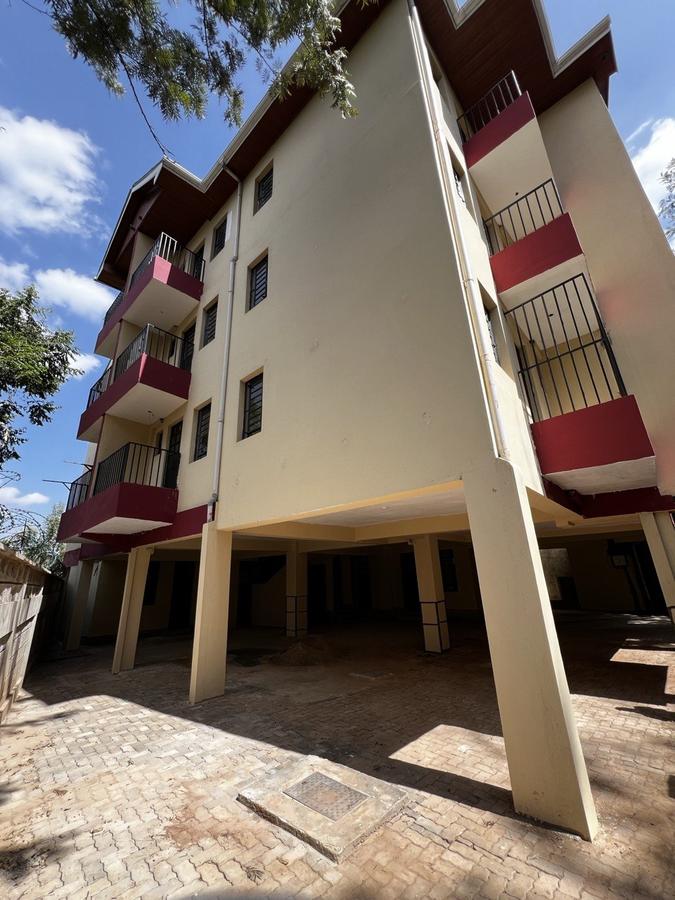Side view of The Wave apartments showing basement parking